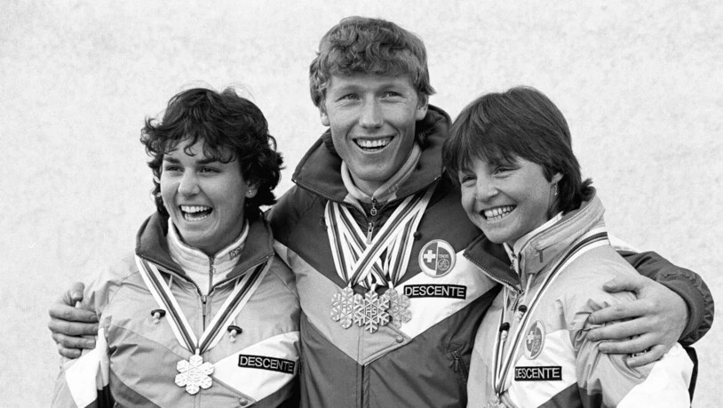 Schweizer Weltmeister-Trio in Bormio 1985: Michela Figini (links), Pirmin Zurbriggen, Erika Hess