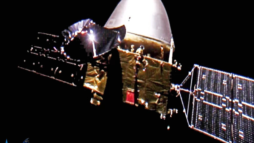 HANDOUT - Dieses von der chinesischen Weltraumbehörde CNSA zur Verfügung gestellte Bild zeigt die Sonde «Tianwen 1» auf dem Weg zum Mars. Foto: -/CNSA/AP/dpa - ACHTUNG: Nur zur redaktionellen Verwendung und nur mit vollständiger Nennung des vorstehenden…