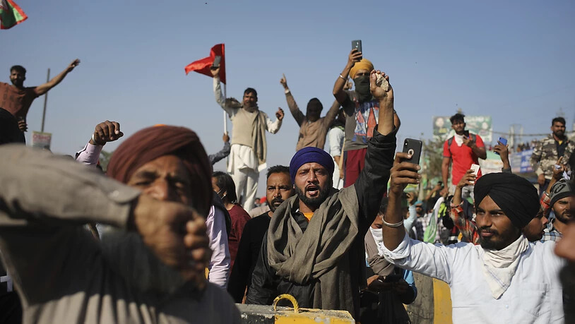 Bauern bei einem Marsch in die Hauptstadt Neu-Dehli. Foto: Altaf Qadri/AP/dpa